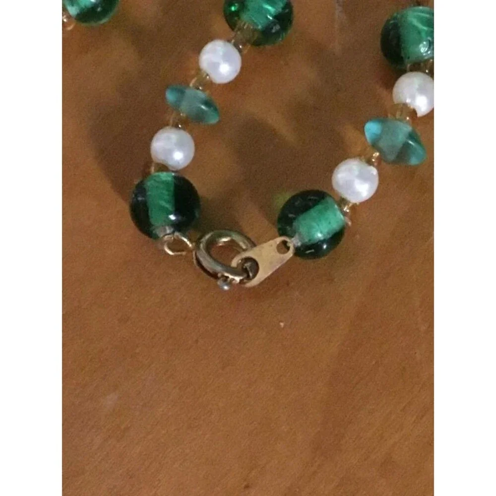 Jade and beads necklace, amazing artistry into that pendant,   Look Closer.
